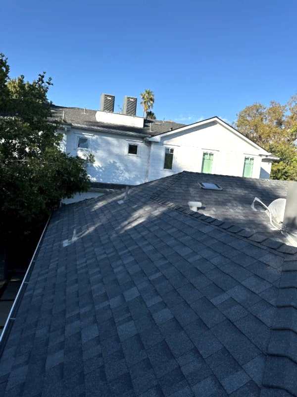 Asphalt shingle roof after shingle replacement