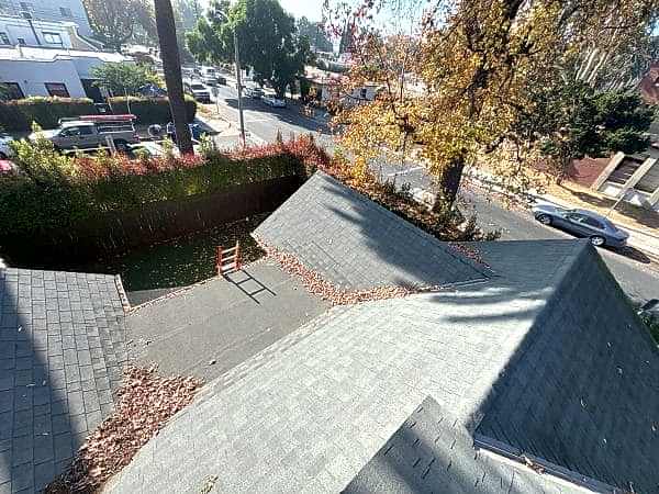 Roof valley and gutter line cleared of leaf debris
