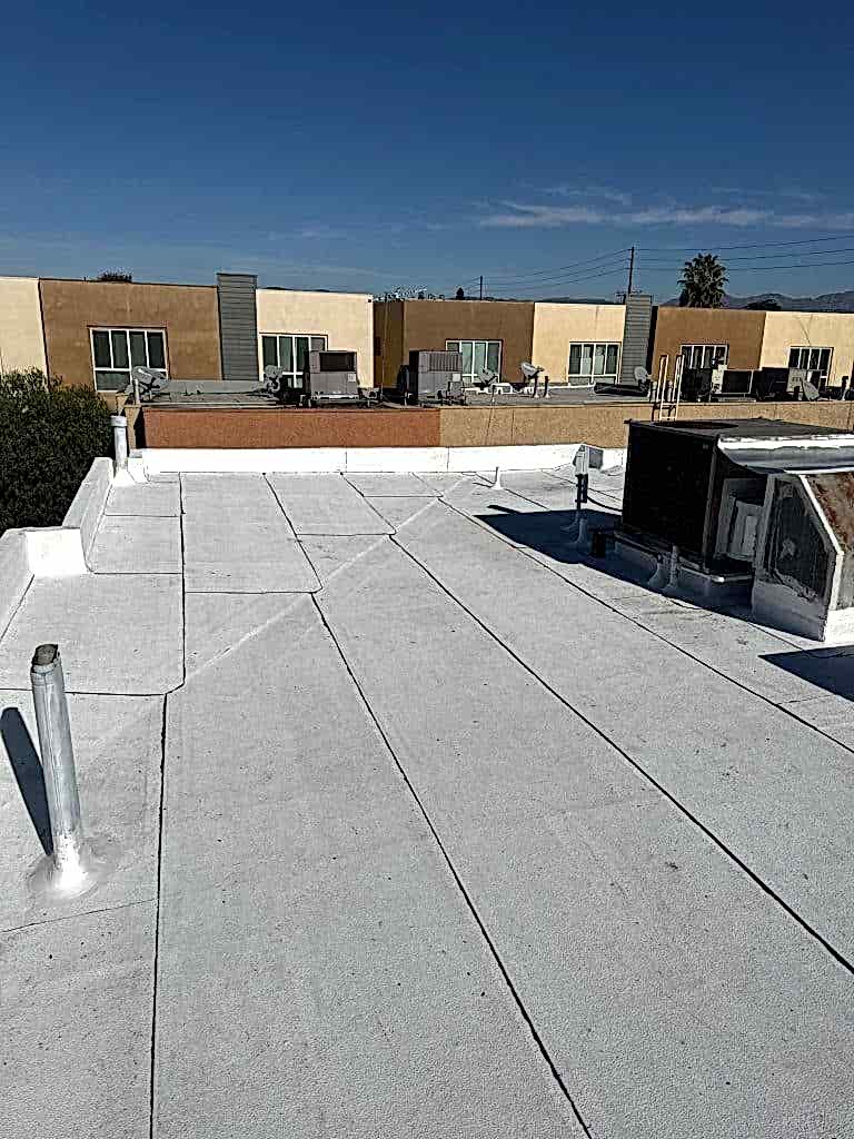 Repaired commercial flat roof membrane