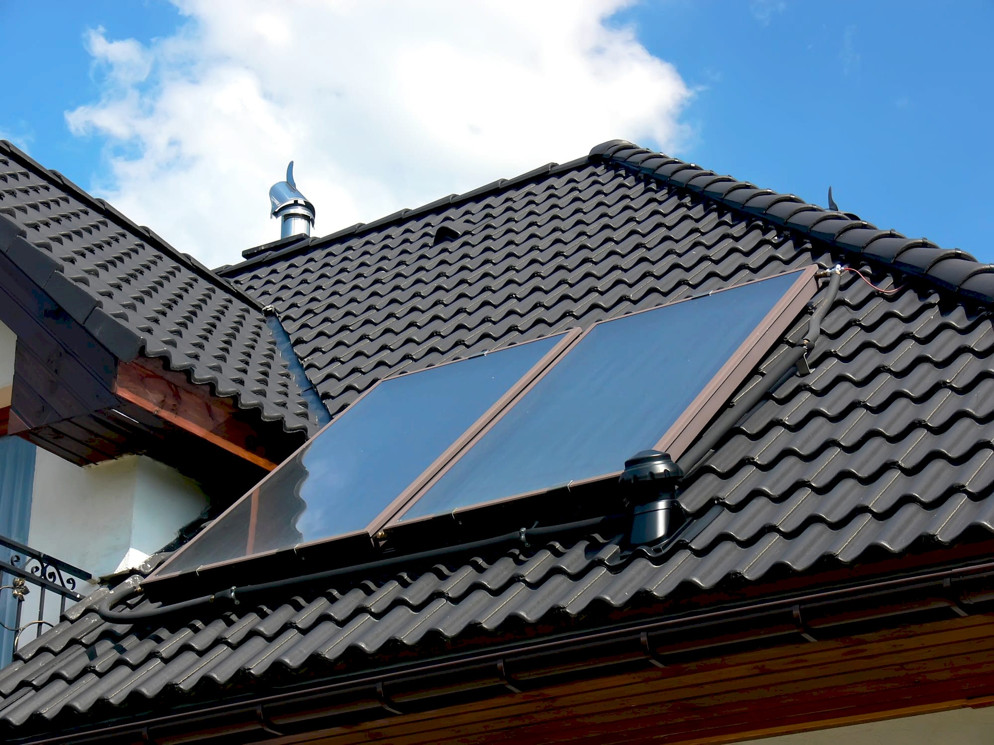 Roof with solar panels on sunny day.