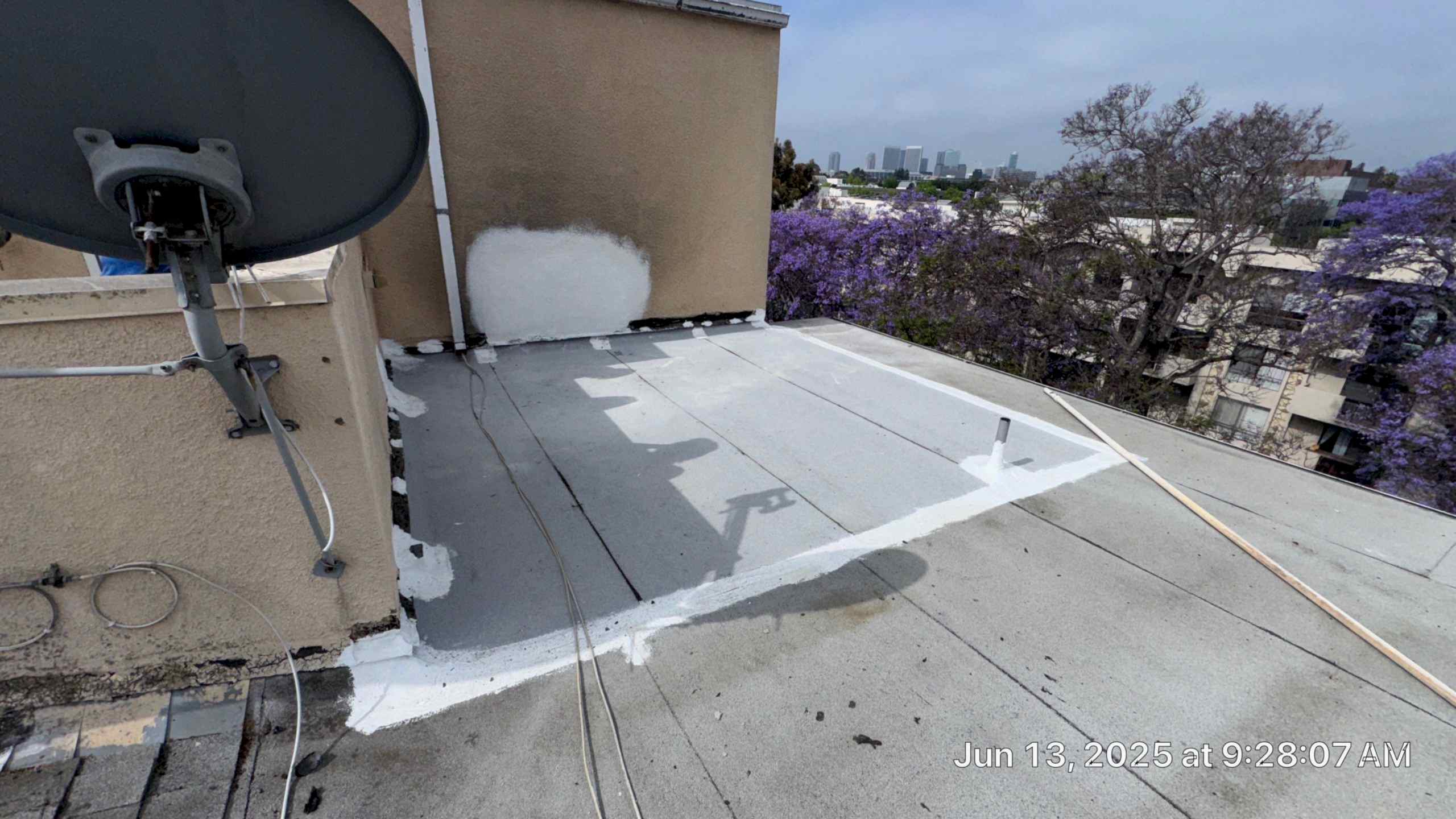 Rooftop with satellite dish and cityscape background