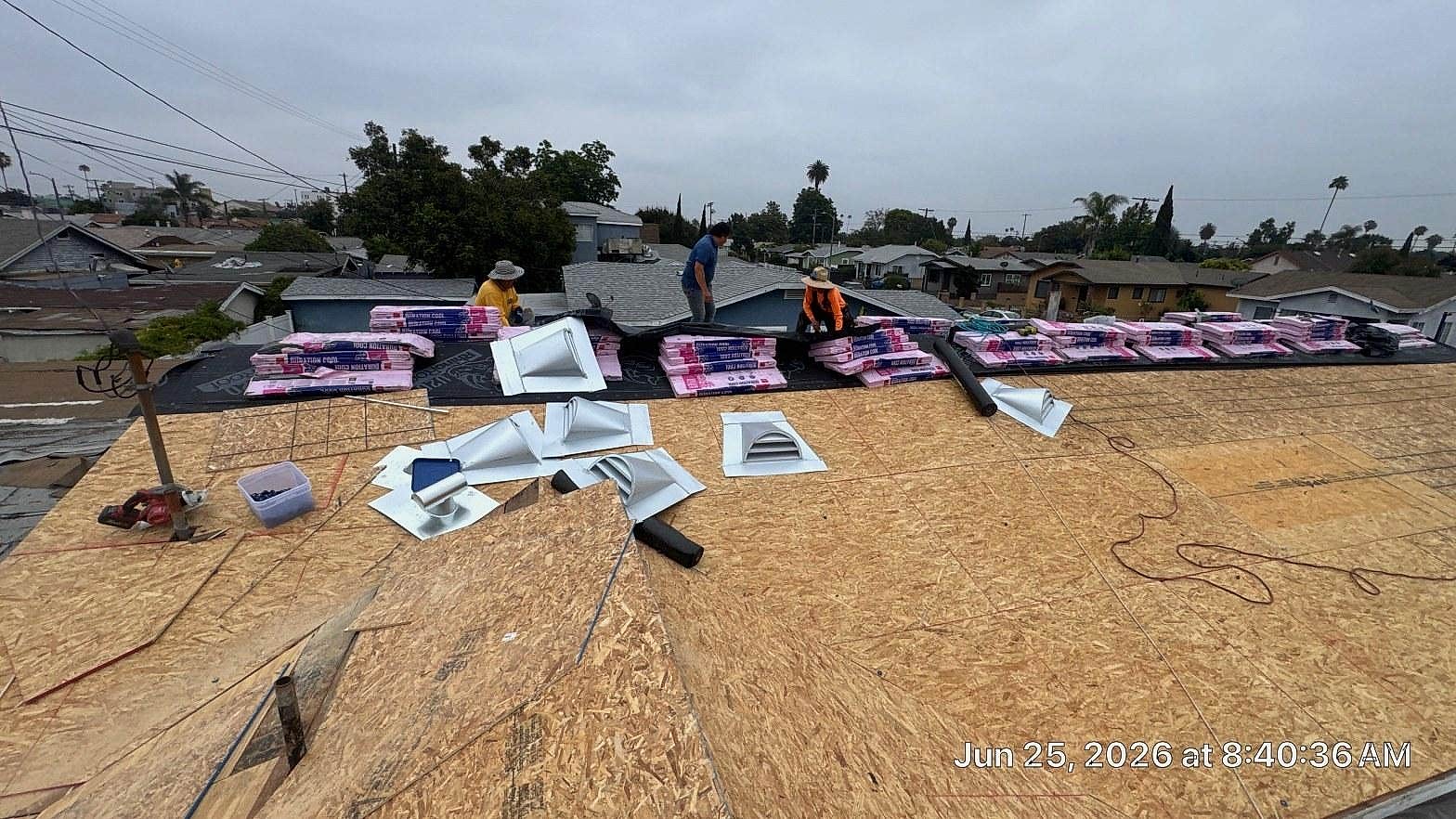 Missing shingles on a California residential roof exposing underlayment after a windstorm